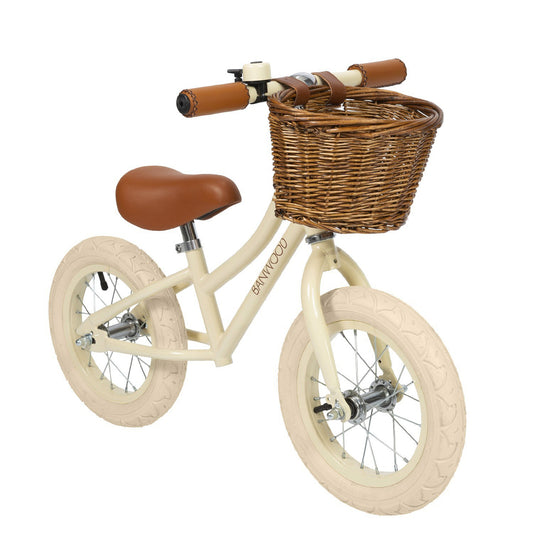 Draisienne vélo d'équilibre 12 pouces Banwood. Cadran acier finition beige laquée, selle et poignées en cuir vegan confortable camel, roues crème.