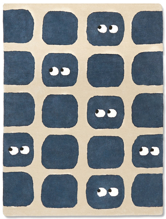 Tapis de haute qualité. Marque française. Certifié coton bio GOTS. Couleurs beige et bleu marine. Ludique, formes géométriques et yeux. Décoration ludique et chaleureuse pour chambre enfant.