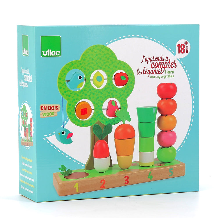 Coffret VILAC complet : plateau, tiges et pièces légumes en bois.