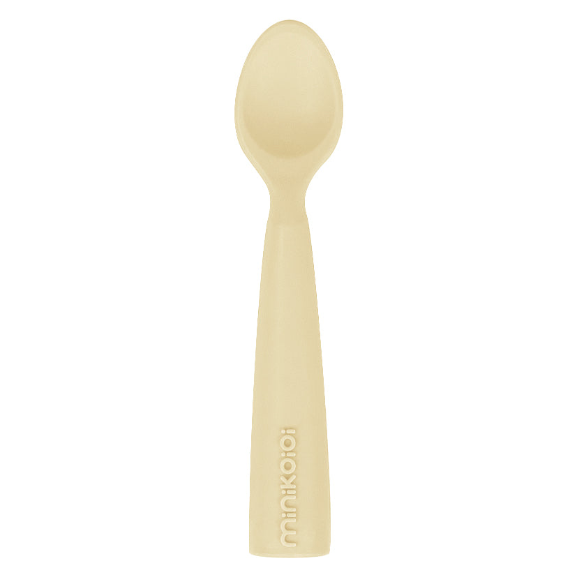 Cuillère bébé pour faciliter l'autonomie alimentaire. Ergonomique et éducatif. Couleur jaune pâle.