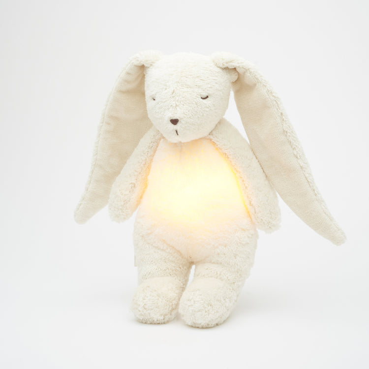 Peluche veilleuse lapin bébé Moonie blanc polaire, douceur et lumière pour apaiser le sommeil de bébé.