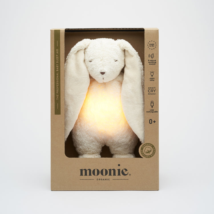 Peluche Moonie lapin blanc polaire, compagnon apaisant pour le sommeil de bébé et les nuits sereines.