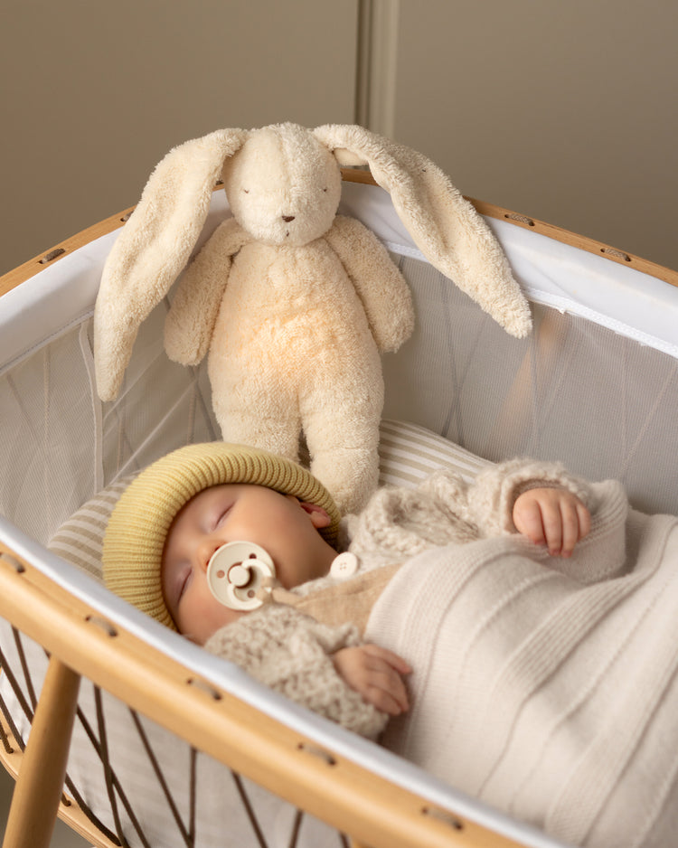 Moonie lapin blanc polaire, peluche lumineuse pour bébé avec veilleuse et sons apaisants.