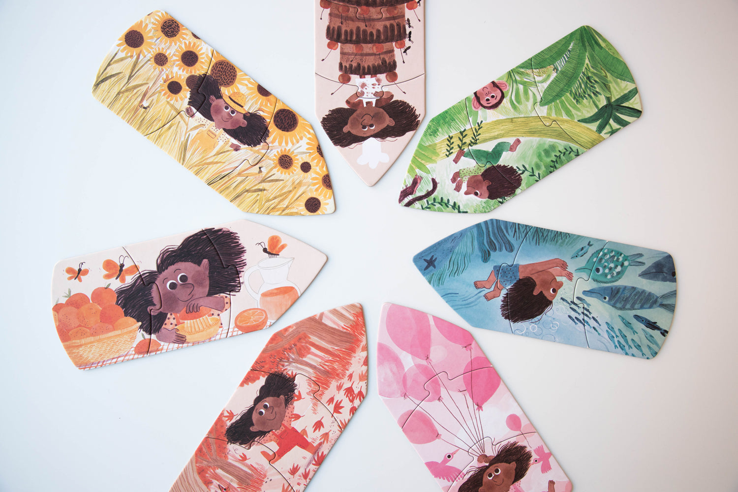 Coffret de puzzles réversibles : recto crayons de couleurs souriants, verso scène illustrant la couleur avec une fillette souriante et pleine de vie. Londji Puzzles