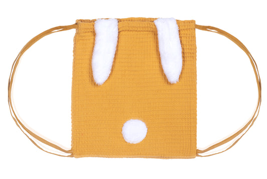 Sac a dos bébé fille ou garçon en coton oeko-tex. Coton gaufré de couleur jaune moutarde, oreilles de lapin et pompon en peluche blanche. Un premier sac à dos souple et léger, idéal pour débuter la crèche ou faire sa rentrée à l'école maternelle.