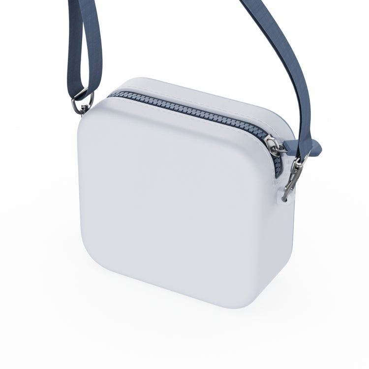 Vue arrière du sac de transport Raton laveur The Zoo Family en silicone bleu clair, avec fermeture zippée et bandoulière