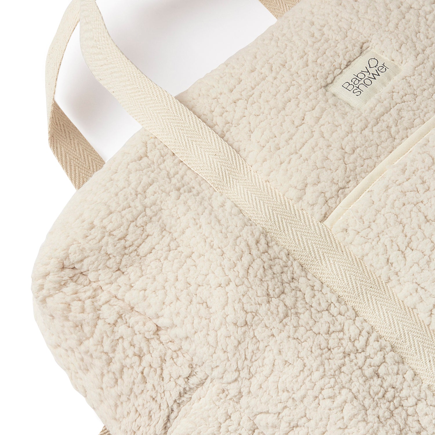 Zoom sur la anse porté main du sac valise maternité de la marque espagnole Babyshower.
